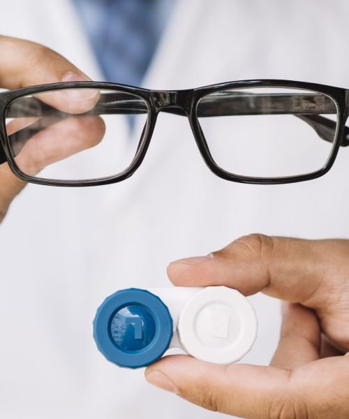 male-doctor-showing-pair-black-glasses-contact-lens